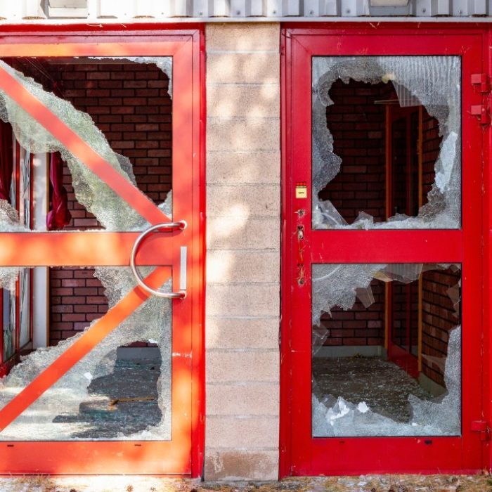 crime-scene-vandalism-smashed-windows-doors-broken-glass-destroy-abandoned-house-property-crime_t20_P1Z34Q